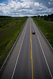 Puffy Clouds And Road
